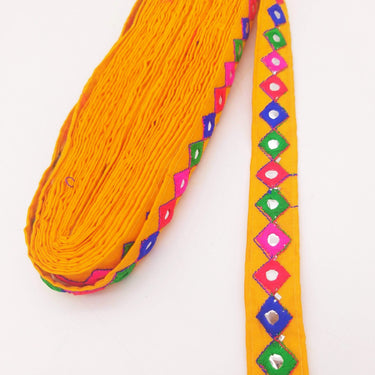 Wholesale Yellow Cotton Fabric Mirrored Trim With Embroidery In Fuchsia Pink, Blue, Red & Green Threads